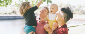 same-sex couple, gender nonconforming with two young beautiful and happy children.